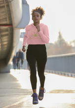 Load image into Gallery viewer, Black woman jogging in pink crop hoodie with Lotus Noir logo in center