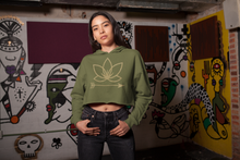 Load image into Gallery viewer, Latina woman in army green crop hoodie with Lotus Noir logo in center
