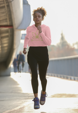 Load image into Gallery viewer, Black woman jogging in pink crop hoodie with Lotus Noir logo in center
